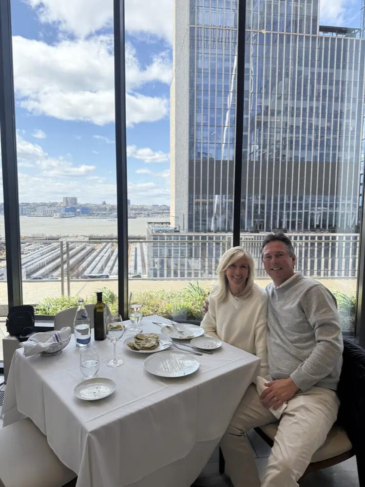 Martin Sumichrast and his wife at lunch overlooking the Hudson River in New York